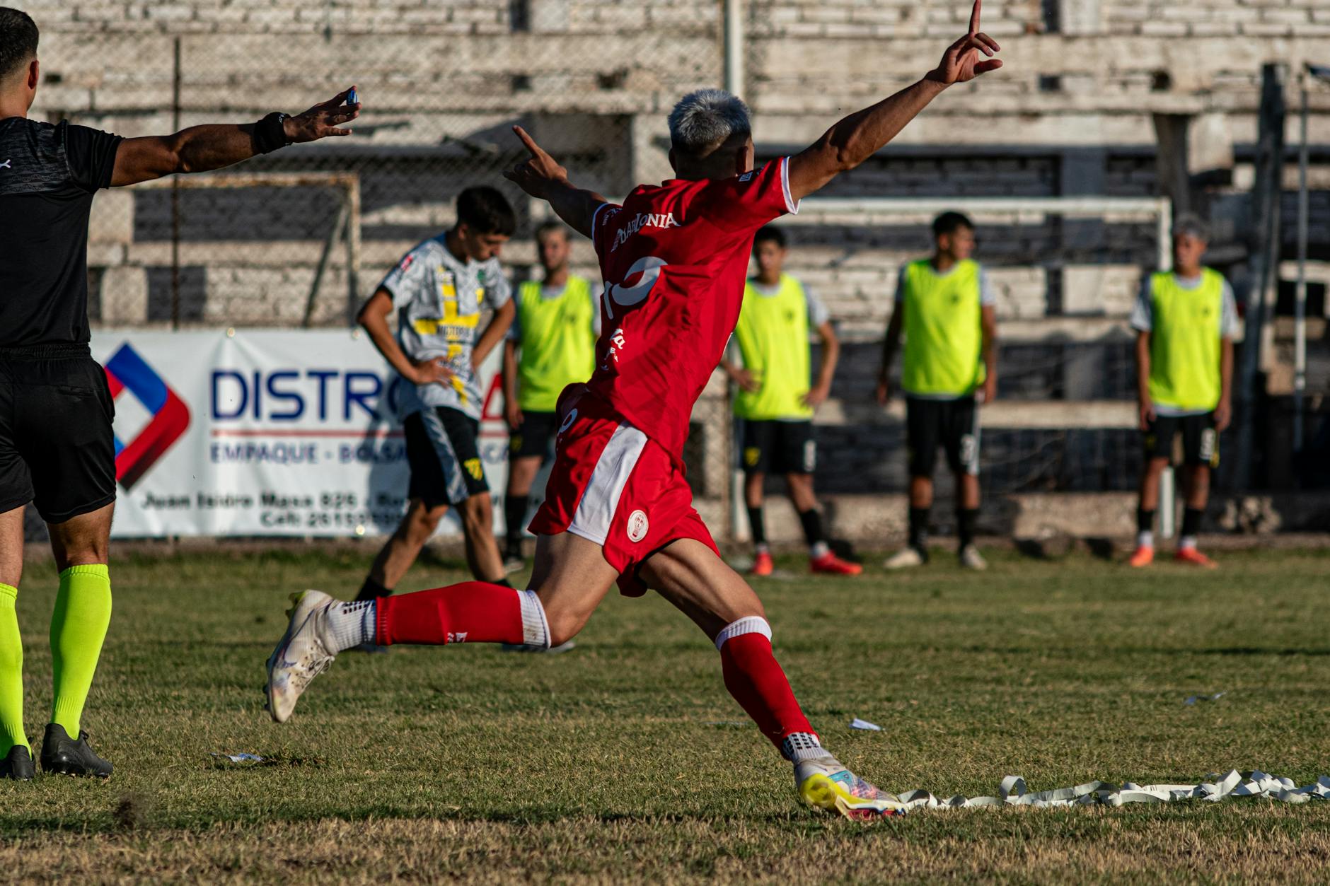 soccer player celebrating goal on field