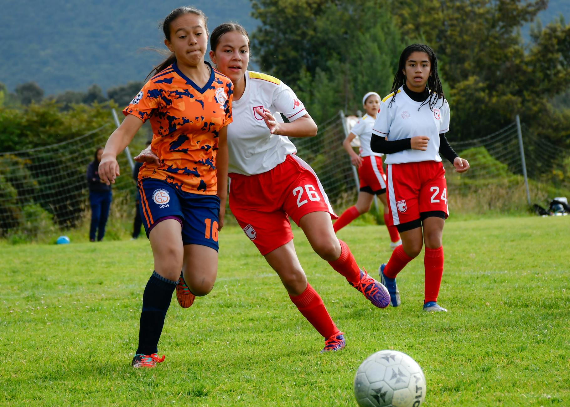 women playing football match